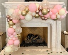 a fireplace decorated with balloons and streamers