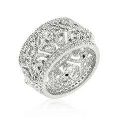 a white gold and diamond ring with intricate designs on the sides, set in 18k white gold