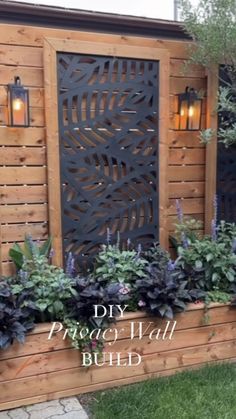 a wooden fence with some plants in it and the words diy project wall build