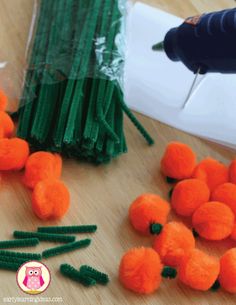 the carrots are being made with scissors and plastic straws on the table next to them