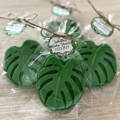 three green leaf shaped soaps wrapped in cellophane