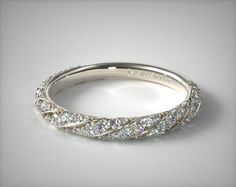 a white gold wedding band with rows of diamonds