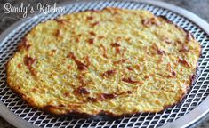 an omelet sitting on top of a metal rack