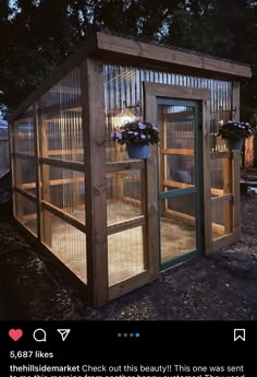 a small wooden structure with plants growing out of it