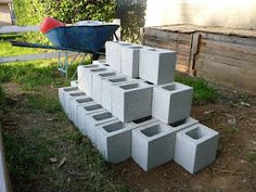 cinder blocks stacked on top of each other in the yard