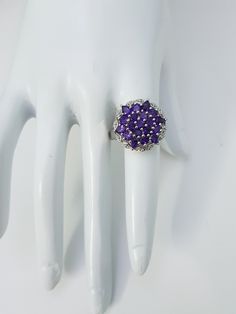 This Natural Amethyst Ring is made with thirteen round and six pear shape beautiful small amethyst Gemstones Cased in 92.5 Sterling Silver material. Gemstone : Natural Amethyst Ring weight : 6.73 grams Metal type : 925 Sterling silver Gemstones Shape :13 Round,6 Pear Gemstones Size : 3 mm Round ,3x4 mm Pear Gemstones count :19 Stones ⦿ Payment Policy :- We accept payment through PayPal. ⦿ Shipping Policy :- * All Items will Be Carefully packed and Shipped Through UPS, Aramex, DHL eCommerce, Indi Purple Gemstone Cluster Ring For Formal Occasions, Formal Purple Gemstone Cluster Ring, Purple Cluster Ring With Accent Stones, Formal Purple Amethyst Ring With Stones, Purple Crystal Ring With Stone Setting For Anniversary, Fine Jewelry Purple Ring With Stone Setting, Fine Jewelry Purple Stone Setting Ring, Purple Multi-stone Round Birthstone Ring, Purple Multi-stone Diamond Ring Gift