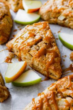 apple scones with caramel glaze and sliced apples on the side, ready to be eaten