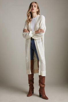 The Epitome Of Polished Layering, This Longline Cardigan  Comes Crafted From A Soft Cotton Blend And Shows Off An Open-Stitch Finish And Gently Puffed Sleeves. Free Of Fastenings, It Looks Effortless Layered Over Smart Separates Or Belted At The Waist For A More Polished Feel. Open Knit Cardigan For Fall Daywear, Fall Open Knit Cardigan For Daywear, Fall Open Knit Cardigan, Spring Textured Knit Sweater Coat For Layering, Spring Layering Textured Knit Sweater Coat, Cotton Open Knit Cardigan For Layering, Spring Open Knit Sweater Coat For Layering, Chic Long Open Knit Cardigan, Long Spring Cotton Sweater