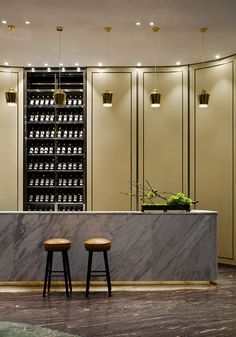 two stools in front of a marble counter