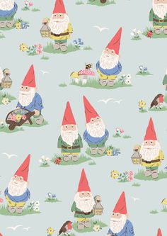 an image of gnomes in the grass with flowers and plants on it's side