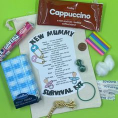 the contents of a new mommy's survival kit laid out on a green background