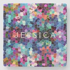 a mosaic tile with the word jesus on it in multicolored letters and shapes