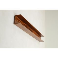 a wooden shelf hanging on the wall