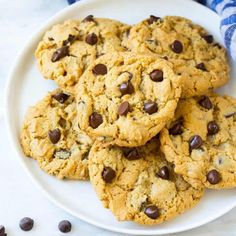 a white plate topped with chocolate chip cookies