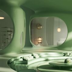 a green room with circular couches and round mirrors on the walls, along with other furniture