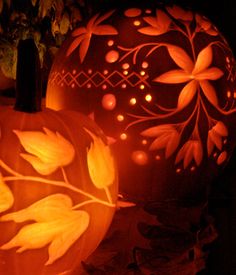 two carved pumpkins sitting next to each other