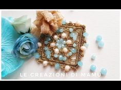 an image of some beads and flowers on a white surface with the words le creazzionii di mannu