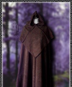 a brown cloak hanging on a purple wall