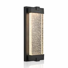 an outdoor wall light that is black and has white lights on the outside of it