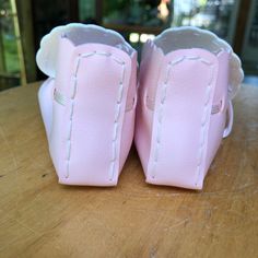 "Hand Crafted Toddler Pink & White Slippers, Booties, Faux Leather Beaded Moccasins. Fits a year to year and half old but see measurements since toddler feet vary. Measurements 2\" wide x 4\" long In great condition!" Pink Moccasins For Spring, Pink Spring Moccasins With Round Toe, Pink Spring Moccasins, Pink Round Toe Moccasins For Spring, Cute Leather Spring Booties, Pink Leather Spring Booties, Spring Closed Toe Faux Leather Booties, Spring Leather Booties With Soft Sole, Pink Leather Moccasins With Round Toe