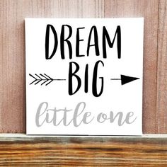 a sign that says dream big little one