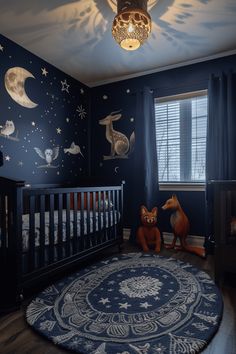 a baby's room decorated in blue and white with stars, deers, and moon decals