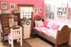 a doll house bedroom with pink walls and furniture