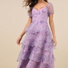 The Lulus Oh-So Stunning Purple Floral Organza Tiered Midi Dress Is Ready To Bring Extra Extravagant Vibes To Any Special Occasion! Sheer Woven Organza Boasts An Elegant Floral Print Throughout As It Shapes A Princess-Seamed Bodice, A Flirty Sweetheart Neckline, And Trendy Puff Sleeves (With Elastic At The Shoulders And Cuffs). The Fitted Waist Tops An A-Line Skirt That Boasts Chic Flouncy Tiers As It Falls To A Breezy Midi Hem. Hidden Back Zipper/Clasp. Details Shell: 100% Polyester. Lining: 97 Feminine Purple Floral Dress, Flirty Purple Floral Print Dress, Purple Tiered Dress With Floral Print, Purple Floral Print Long Sleeve Midi Dress, Purple Floral Print A-line Midi Dress, Tiered Midi Dress, Lulu Dresses, Purple Floral, Sweetheart Neckline