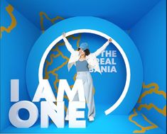 a woman standing in front of a blue background with the words i am one