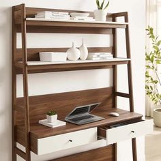 a computer desk with drawers underneath it and a laptop on the top shelf next to it