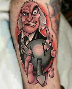 a man's leg with a cartoon character on it and an arrow in his hand