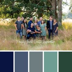 a group of people standing next to each other in a field with trees and grass