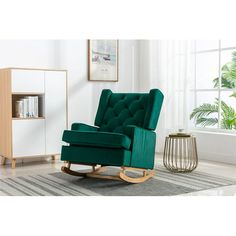 a green rocking chair in a living room