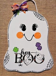 a paper cut out of a ghost with the words hey boo on it's face