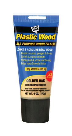 a tube of plastic wood filler on a white background