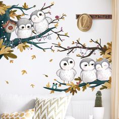 three owls sitting on a tree branch wall decal