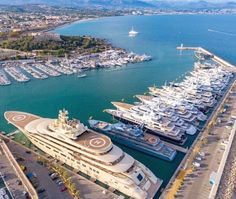 an aerial view of several boats docked in the water