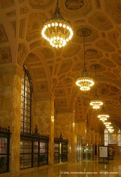 an ornate building with chandeliers hanging from the ceiling