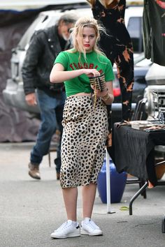 Ava Phillippe's Satin Leopard Midi Skirt, Message Tee, and Adidas Sneakers Look for Less Leopard Midi Skirt Outfit, Leopard Skirt Outfit, Leopard Midi Skirt, Ava Phillippe, Leopard Print Midi Skirt, Dress And Sneakers Outfit, Midi Skirt Outfit, Leopard Skirt, Sneakers Looks