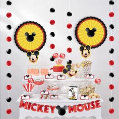 a mickey mouse birthday party with food and decorations