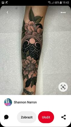 a person with a flower tattoo on their leg