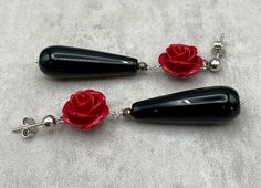 "Drop earrings with 925 sterling silver, red roses, faceted black onyx and hematite. LENGTH: 2.3 inches - 5,9 cm long - 5,5 gr. each MATERIALS: 925 Sterling Silver Onyx: It enhances self-control, self confidence and stimulates the power of wise decision-making. It encourages happiness and good fortune. Hematite: It grounds and protects us. It strengthens our connection with the earth, making us feel safe and secure. It endows us with courage, strength, endurance and vitality. A \"stone for the m Elegant Black Jewelry With Rose Design, Red Gemstone Earrings For Valentine's Day, Red Rose Design Dangle Jewelry, Red Rose Earrings, Rose Red Flower-shaped Earrings For Pierced Ears, Red Flower-shaped Earrings With Rose Design, Rose Red Flower-shaped Earrings With Rose Design, Presents For Mum, Uk Gifts