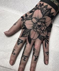 a person's hand with flowers on it and the words, i love you