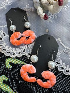 But oh so delicious! Plastic charms of cocktail shrimps  are on surgical steel ear wires, topped with pearlized bauble beads.  These earrings measure about 3 inches long. Alec Core, Shrimp Earrings, Plastic Charms, Funny Jewelry, Earrings Kawaii, So Delicious, Clay Crafts, Kitsch, Ear Wires