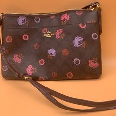 -New And Never Used -Purchased At Coach -Pink And Purple Floral Crossbody Purse/Bag -Have You Been Searching For This One?!Complete Your Collection! -Smoke, Pet, And Fragrance-Free Home! -Fast Shipping! Same-Day Shipping Is Available Before 4pm Est. -Items Listed Below $15 Are Firm In Price, Thanks So Much For Your Interest. -Finders Keepers! Ask Before You Buy, I’m Unable To Facilitate Returns Post-Purchase. -Open To Offers But Please Be Fair, Also You Can Always Bundle & Save! Pink Coach Bag As Gift, Coach Bags Perfect As Gifts, Coach Bags Perfect For Gifts, Coach Bag For Gift, Multicolor Coach Bags As Gifts, Multicolor Coach Bag With Zipper Closure, Coach Brown Bag As Gift, Coach Bags With Removable Pouch As Gift, Coach Brown Bag For Gift