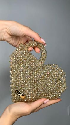 Crystal gold KNITKOS heart love bead bag, Bead shoulder bag, Women Bead bag, Bead Bag, bag Bead bag,Crystal Bead Bag,back shoulders bag, Women handbags Dimensions - Width: (19.) - Height: (14.) - Depth: (5sm.) Bags are 100% handmade.This size making it perfect to hold your keys, cards, money and smartphones. I hope you collect great memories with this bag. SHIPPING (time 14-20 days) also you can choose EXPRESS shipping (7-14 days) SHIPPING - This clutch is made and ready to ship - Ships w Heart-shaped Beaded Bag As Gift, Heart-shaped Beaded Bag For Gifts, Glamorous Heart-shaped Bag For Gift, Glamorous Heart-shaped Gift Bags, Gold Bags With Gold Beads For Gifts, Handmade Gold Handheld Evening Bag, Crystal Bead Bag, Hand Beaded Bag, Diy Crochet Bag