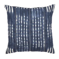 the indigo blue and white pillow is made from an old piece of cloth that has been dyed