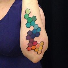 a woman with a colorful tattoo on her arm