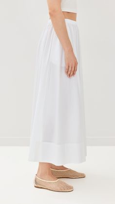 Find JENNI KAYNE Lauren Skirt on Editorialist. Fabric: Lightweight, non-stretch weave. Covered elastic waistband. On-seam hip pockets. Shell: 100% cotton. Unlined. Dry clean. Imported, China. Measurements: Measurements from size S Length: 36.25in / 92.0cm Voluminous Skirt For Daywear, Relaxed Fit Gathered Skirt For Daywear, Gathered Full Skirt For Daywear, Elegant Long Skirt With Relaxed Fit, Daywear Bottoms, Pleated Skirt With Relaxed Fit, Daywear Bottoms With Pleated Waist And Flared Skirt, Stretch Lined Maxi Skirt For Daywear, Flared Skirt With Fitted Waist And Lining, Long Stretch Skirt With Pleated Waist