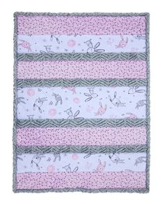 the pink and white baby blanket has three different designs on it